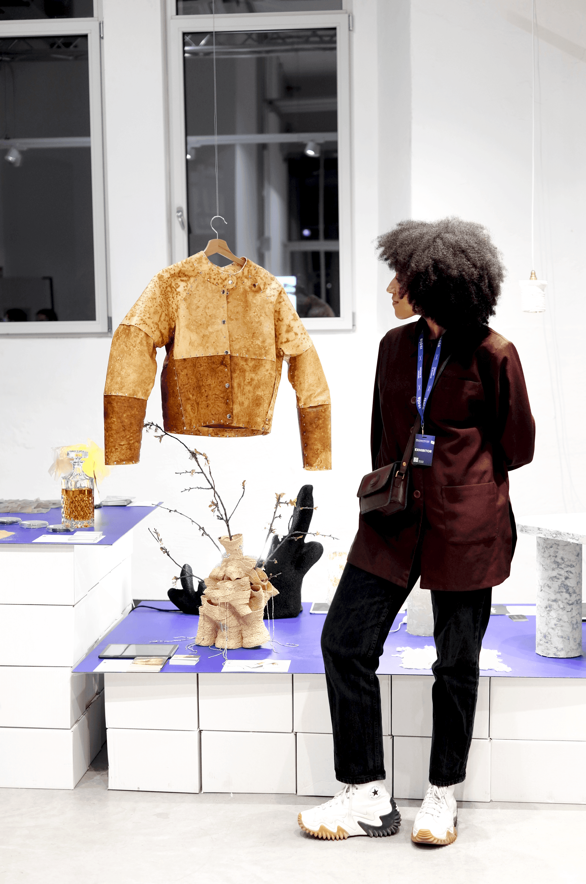  Designer Annah-Ololade Sangosanya with her jacket made of mycelium  skins, “Fungal skins: macro” at the Isola Design Festival 