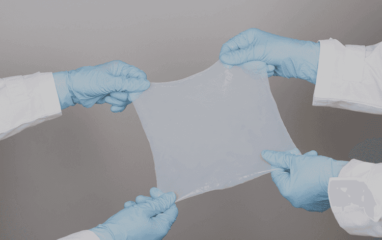 JeNaCell (Evonik) | Germany

Hydrogel dressings grown by bacteria, JeNaCell produces medical sheets of pure bacterial cellulose through controlled fermentation. Marketed as epicite®, the sterile hydrogel contains >95% isotonic saline, offering high moisture donation, strong exudate absorption, and pain-free removal. Stable, biocompatible, and residue-free, it is applied to chronic and acute wounds, showing how microbial biopolymers enter clinical practice at scale.