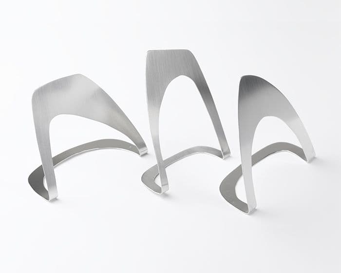 Sabrina creates innovative pieces with unconventional shapes, pushing traditional boundaries.