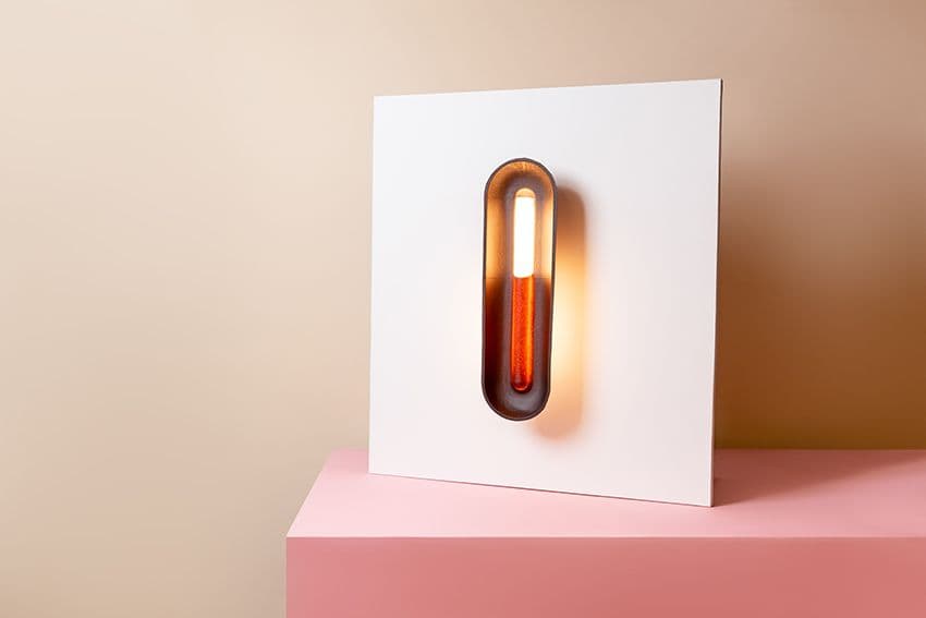 MYCOTEX by NEFFA invited Marc Th. van der Voorn to design a lamp entirely made of mycelium. The lamp showcases the potential of MYCOTEX and the potential of the NEFFA manufacturing method. Where the fashion industry likes to have a flexible material, Marc asked for a more sturdy and stiff substance to support the shape of the shell. The recipe has been further developed to reach these requested product specifications. The light shows three different ways of lighting: direct, through the transparent MYCOTEX material and the light reflection on the wall, giving it its unique appearance when off or on.
Design: Marc Th. van der Voorn
Material: MYCOTEX, S14 LED tube, LED light holder