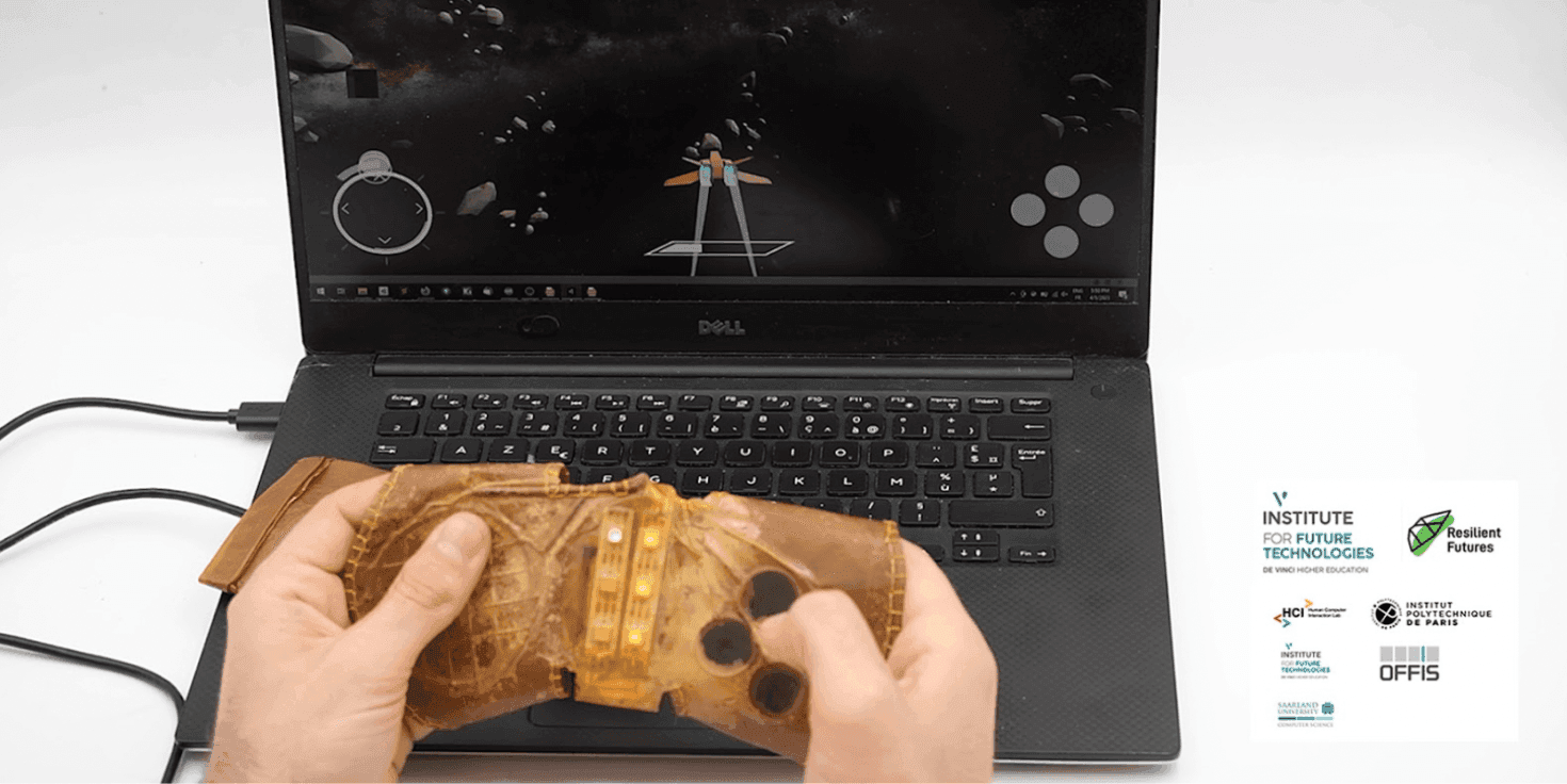 The Biohybrid Device — a video game controller grown through biofabrication and digital manufacturing. Using SCOBY (a symbiotic culture of bacteria and yeast), conductive elements, sensors, and outputs are gradually embedded into the material through natural morphogenetic growth.