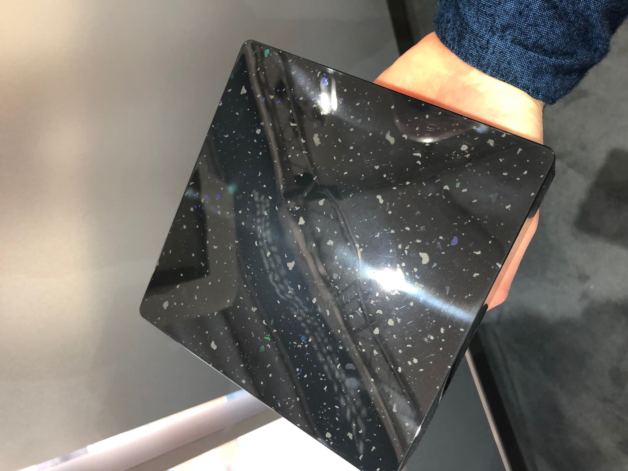 Photo of a recycled material part taken at K-Fair. Through induction-based mould heating, its surface gloss and finish were enhanced, overcoming one of the key limitations of recycled polymers.