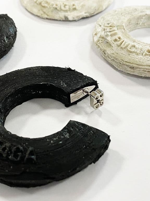 Balenciaga x Shahar Livne: earrings crafted from ocean-sourced plastic waste cleaned by Oceanworks® and upcycled plastics from recycling facilities, combined these with calcium carbonate, a byproduct of the marble industry and a natural agent in fossilisation